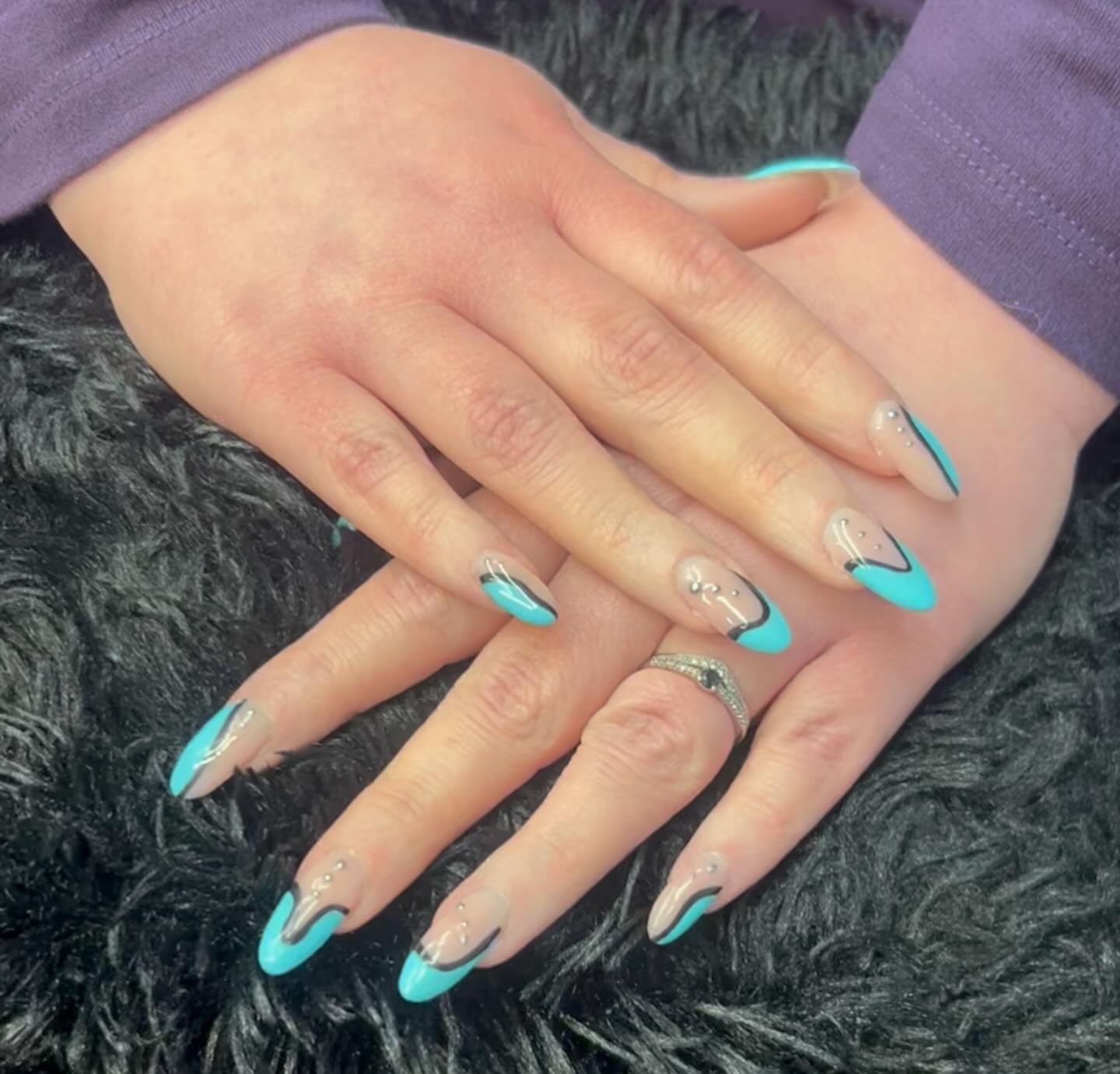 Turquoise and chrome French tip nails with small gems, done for a concert at BeYOUtiful Nails in North Bay