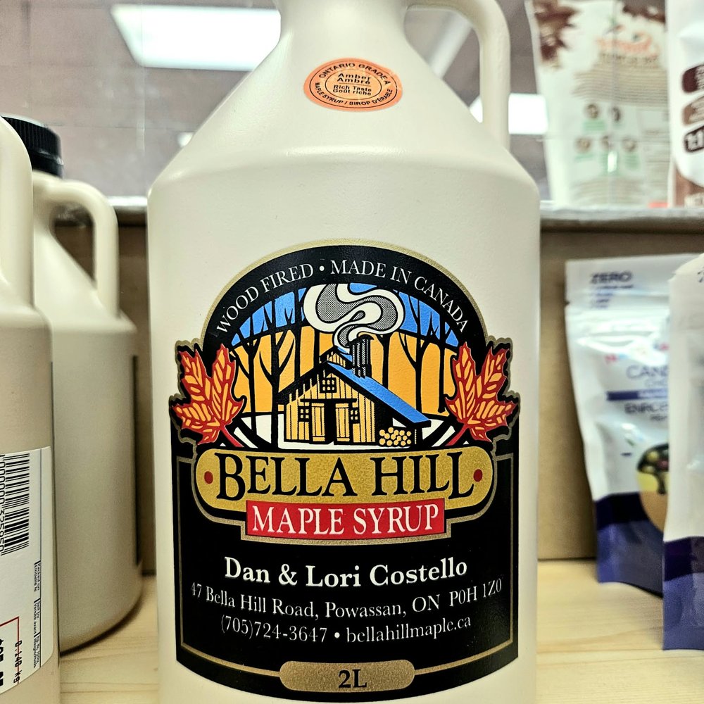 A jug of Bella Hill maple syrup from a local maker on the shelf at Bins & Bins