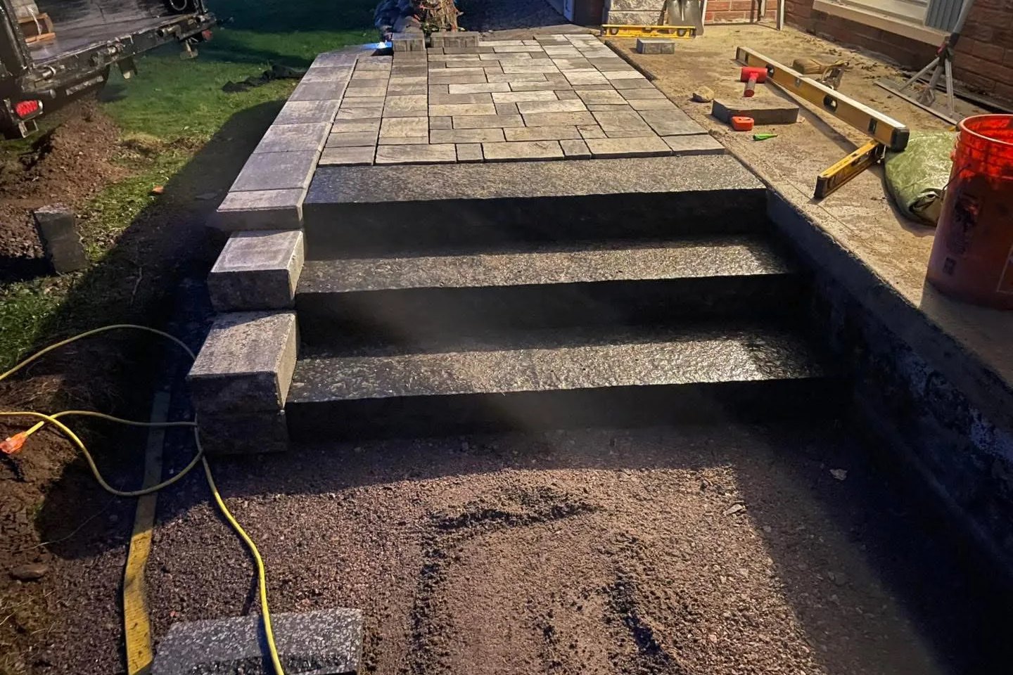Paver porch with block steps built by Bouwers Design Landscaping