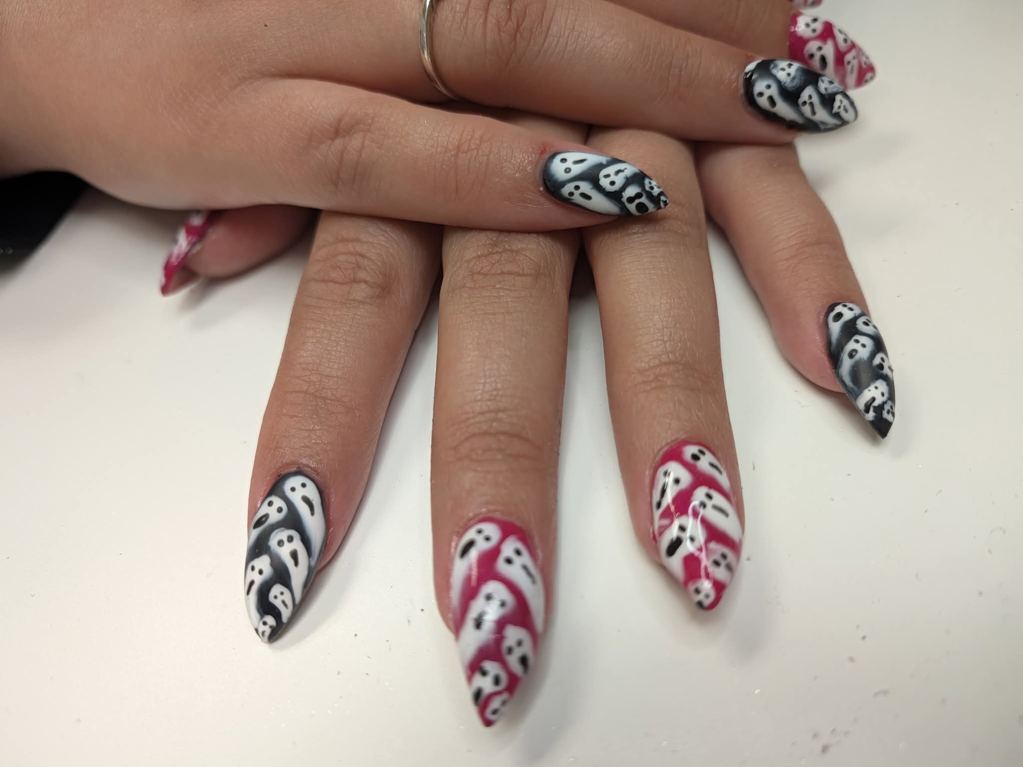 Hand painted Halloween ghost nail art in black, white and pink by Brea's Beauty Boutique
