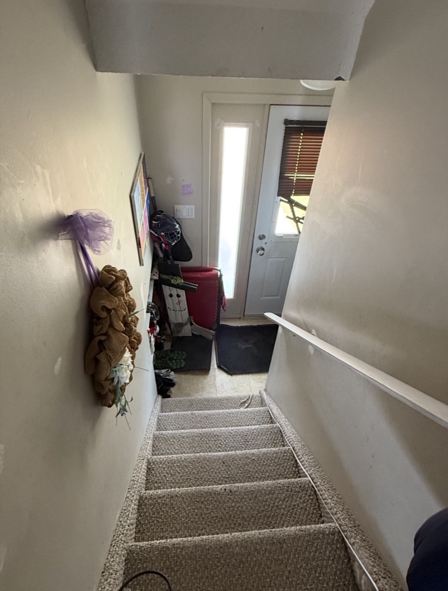 The same front entry and stairs clear after a Busy Bee's Kleaning clean