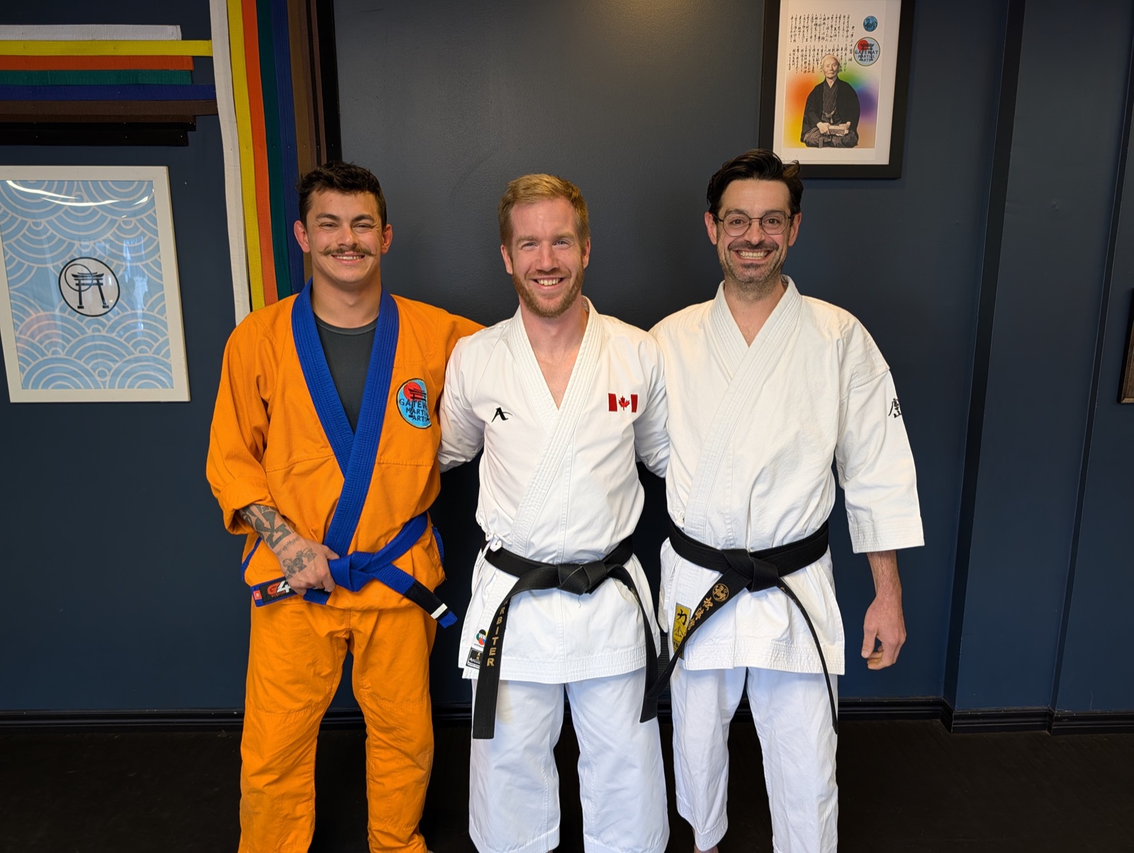 Sensei Adam Arbiter in his Team Canada gi with two of the Gateway Martial Arts coaches at the dojo