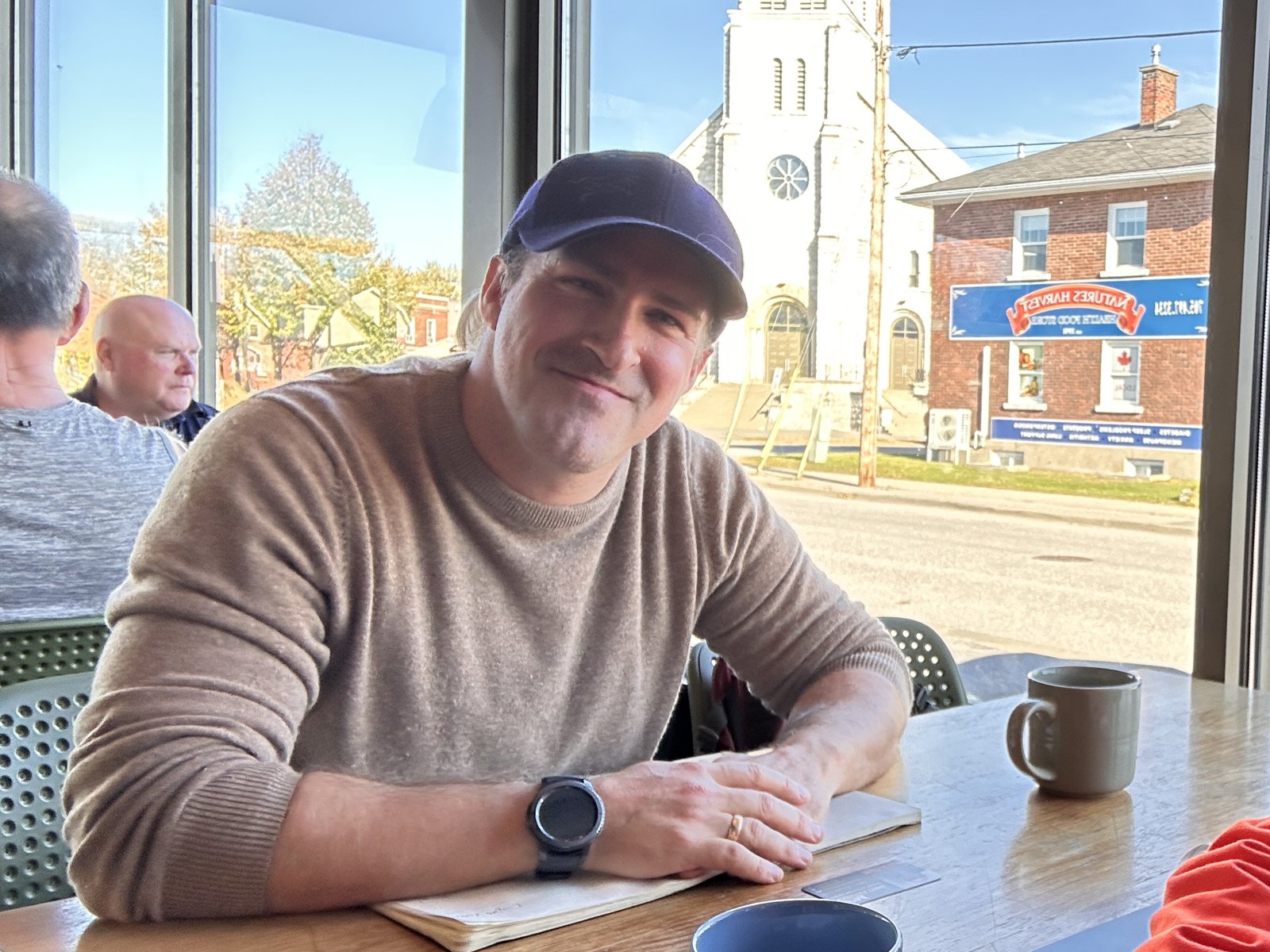 Simon Foster, senior hydrogeologist with Geofirma Engineering, at a cafe table in North Bay