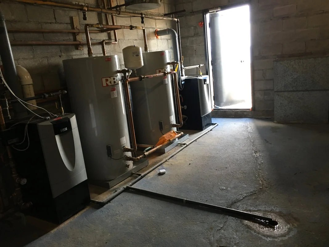 Equipment and pipework in a mechanical room during a Harwood installation