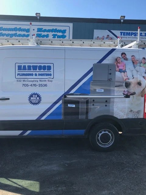 A Harwood Plumbing & Heating service van outside the North Bay shop
