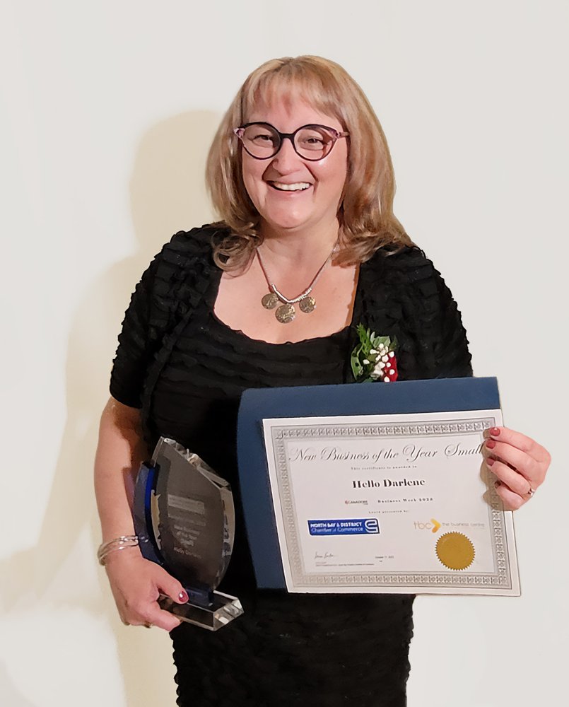 Darlene Tripp holding the New Small Business of the Year award from the North Bay and District Chamber of Commerce