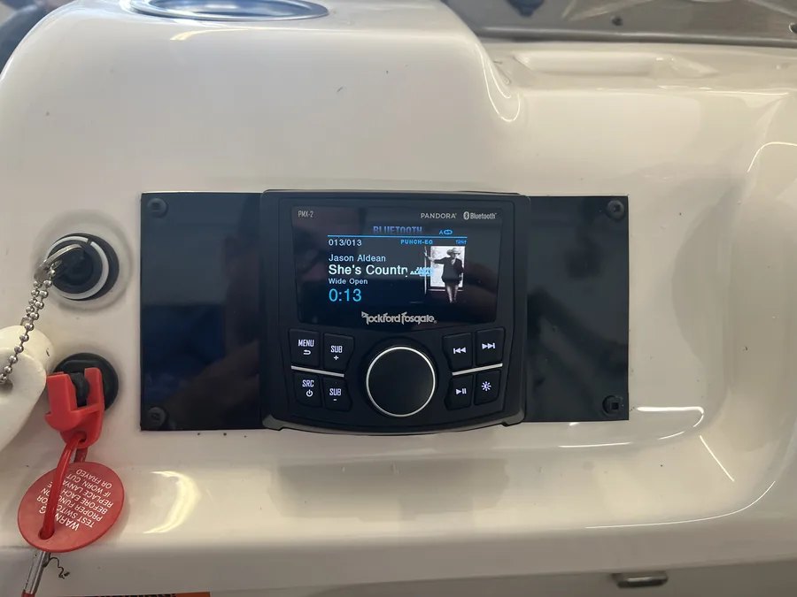 A Rockford Fosgate marine stereo installed in a white boat console