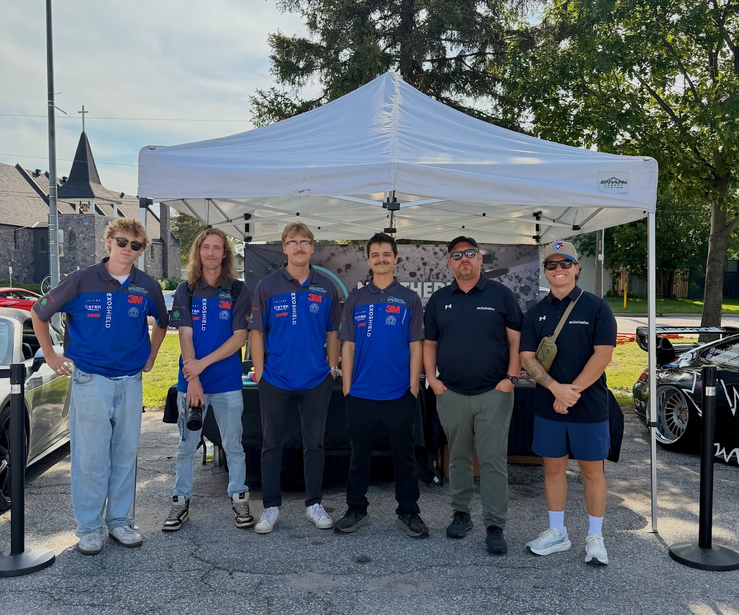 The Northern Detail & Polish team at their booth at a North Bay car show