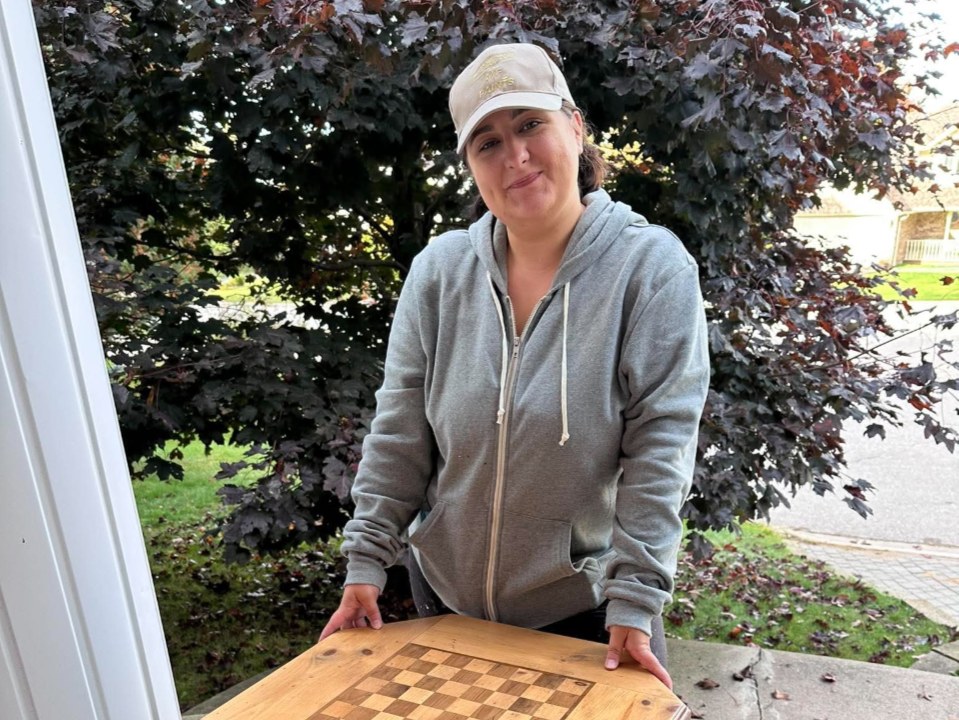 Cyan Goulet, owner of The Reno Chick, with a refinished chess table she made for a North Bay client